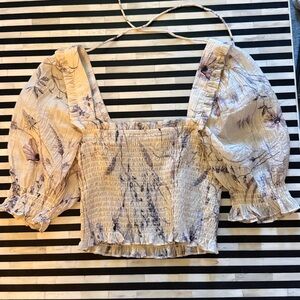 Crop smocked floral top. Ties in the top in the back.